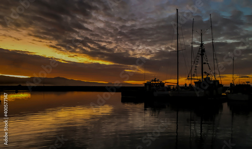 Boats at the dock in the early morning under a beautiful sky