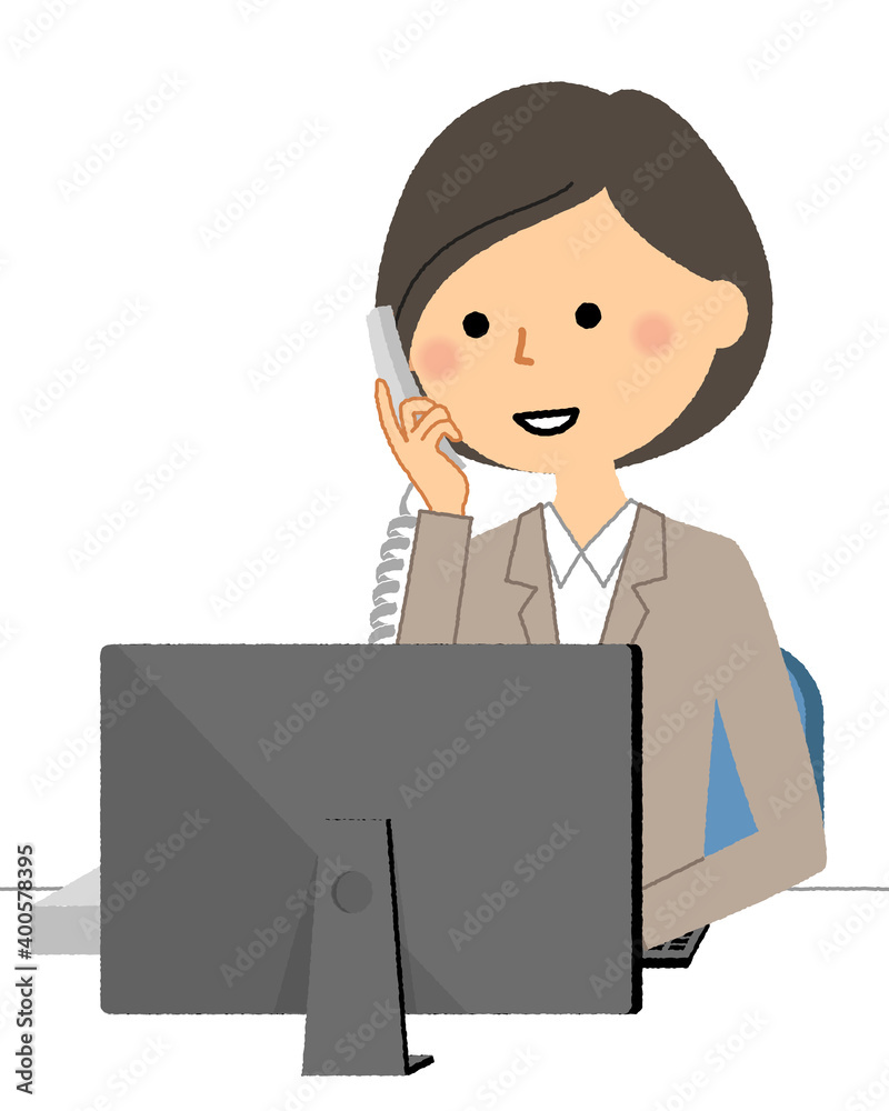 PC前で電話するスーツの女性