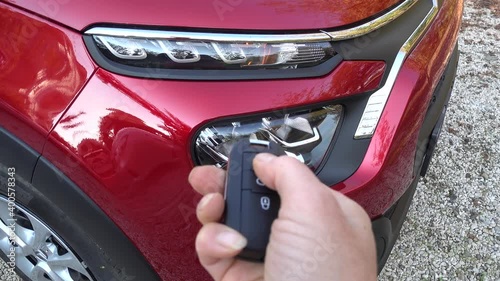 Fethiye, Turkey - 20th of December 2020: 4K Front lamp gives light when locking car with remote control key
