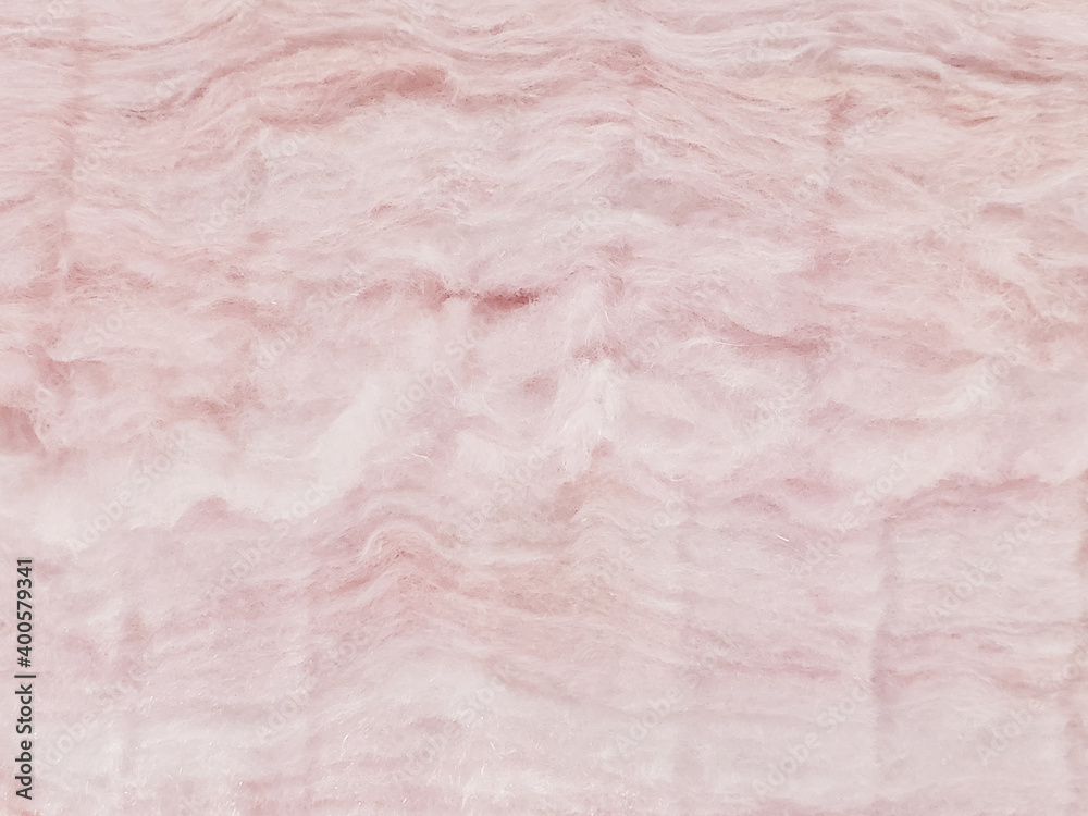 closeup of layers of pink fiberglass insulation closeup of layers of pink fiberglass insulation