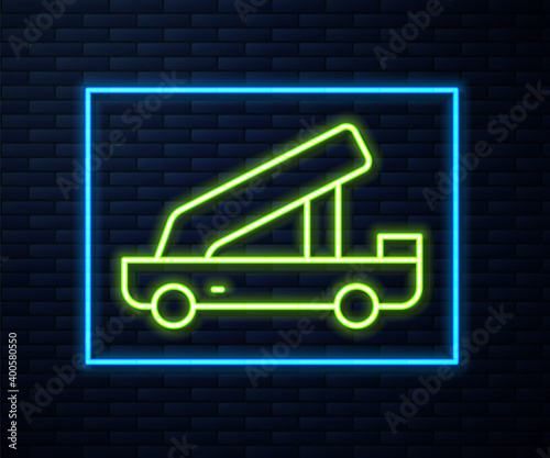 Glowing neon line Passenger ladder for plane boarding icon isolated on brick wall background. Airport stair travel. Vector.