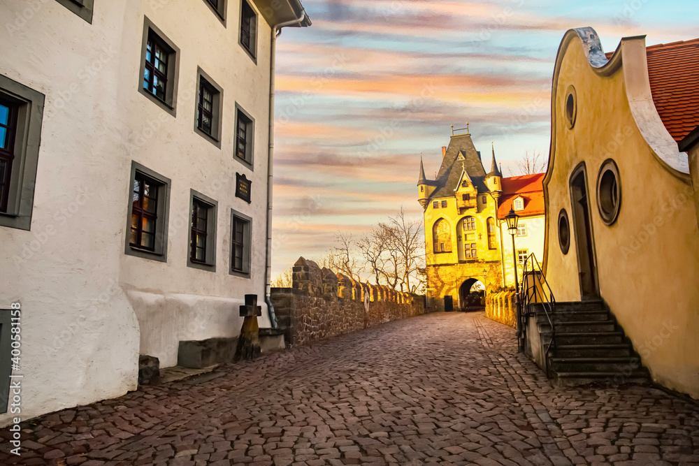 Meissen,Saxony, Germany. 17.02. 2019, .pedestrian old German street at sunset. cobblestone pavement. Meissen,Saxony, Germany. 17.02. 2019, .pedestrian old German street at sunset. cobblestone pavement.