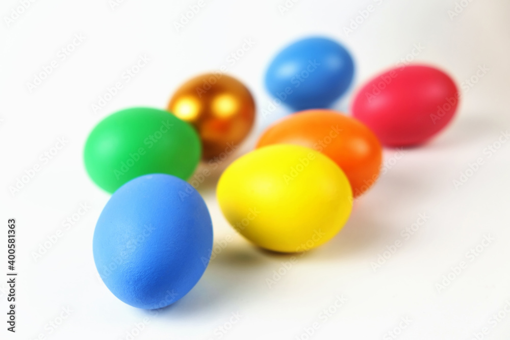Bunch of colorful Easter eggs on the white surface, selective focus Bunch of colorful Easter eggs on the white surface, selective focus