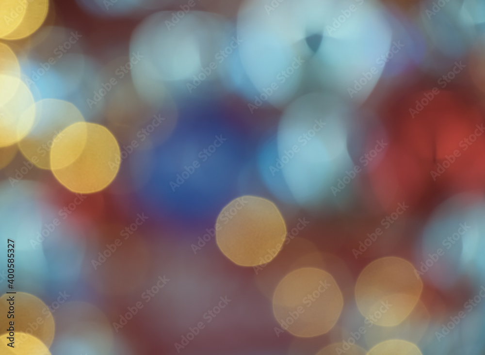 Blurry colorful Christmas bokeh lights festive background.