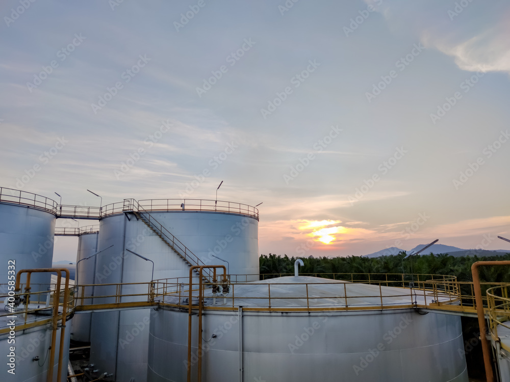 Crude oil export factory industry And oil storage tank. Oil storage plant from industry zone Aerial view. Factory industrial atmosphere sunset 