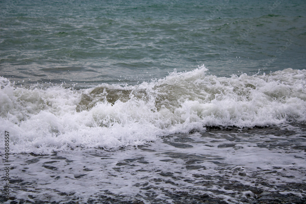 The choppy Black Sea before a storm, Sochi on a warm, cloudy summer day.