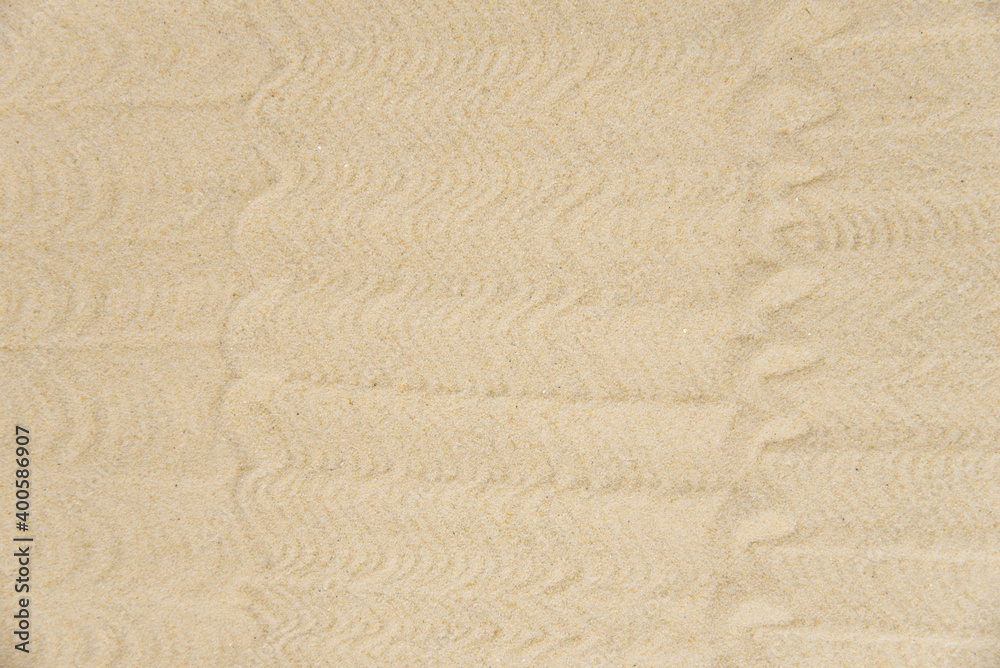 Obraz premium Zen sand garden meditation stone background with copy space. Stones and lines drawing in sand for relaxation. Concept of harmony, balance and meditation, spa, massage, relax. Set Sail Champagne color