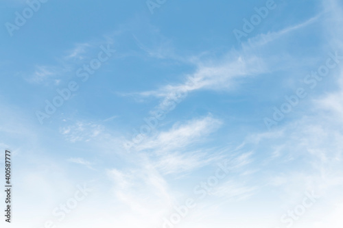 Summer Blue Sky and white clouds background. Beautiful clear cloudy in sunlight spring season. vivid cyan cloudscape in nature environment. Outdoor horizon skyline with spring sunshine. 