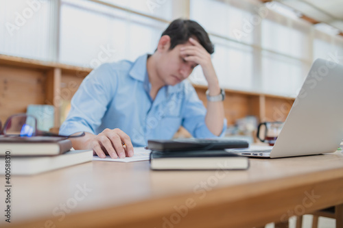 Tired businessman hold pencil at workplace in office and headache or angry. Overworking, making mistake, stress, termination, fail, bad, sad tired or depression concept