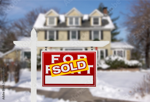 Sold Home For Sale Real Estate Sign in Front of New Snow Covered House