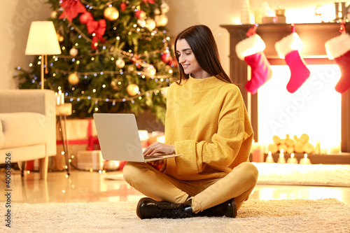 Young woman with laptop at ...