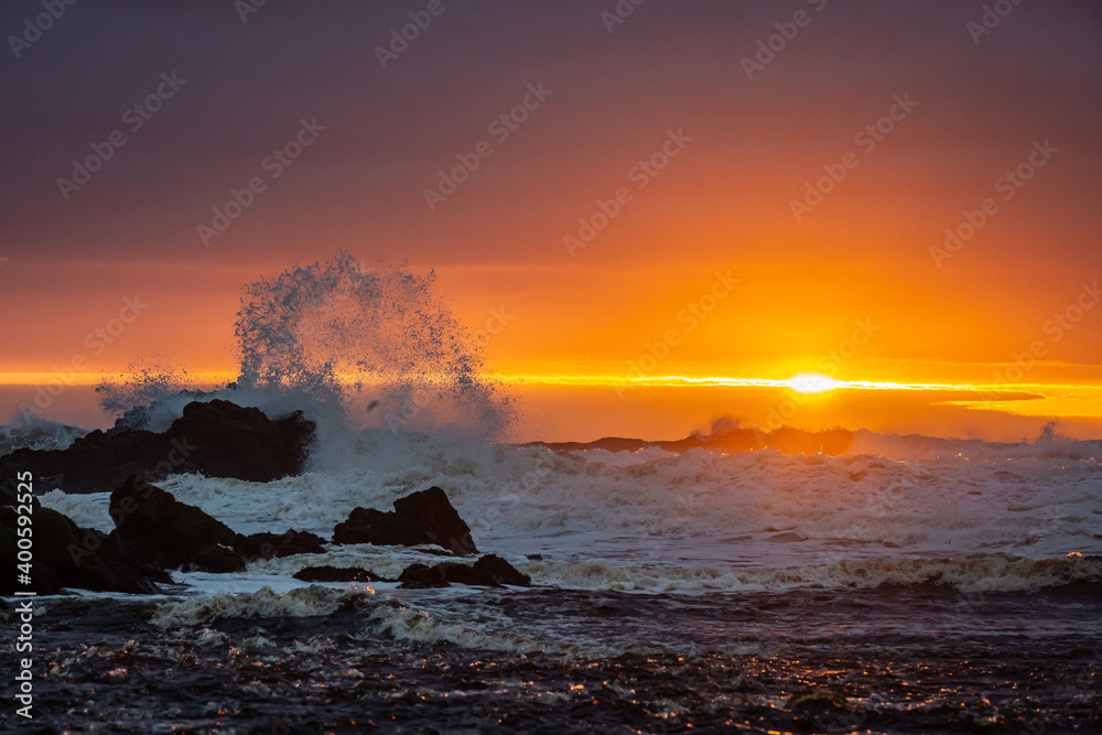 waves break at sunset on north coast northern ireland