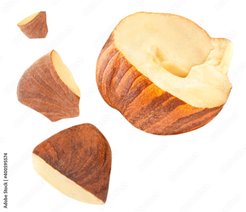 Crushed hazelnuts isolated on white background. Hazelnut macro. High resolution image.. Crushed hazelnuts isolated on white background. Hazelnut macro. High resolution image..