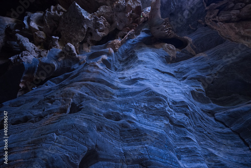 Blue striped stone of cave wall 