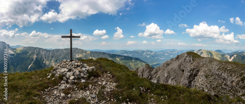 Summit cross of Frieder mountain in Bavaria, Germany, mountain panorama