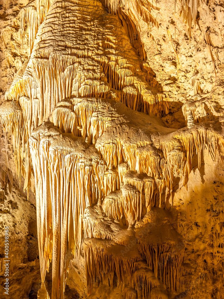 View in the caves at Carlsbad Caverns National Park, New Mexico, Carlsbad is a well-known national park famous for its limestone caves, rock formations & hiking trails.