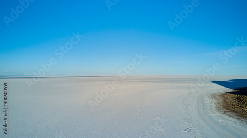 Aerial of Salar de Uyuni, Salar de Tunupa, worlds largest salt flat, in the altiplano of Bolivia in the andes mountains. Worlds biggest lithium source and popular travel destination in South America