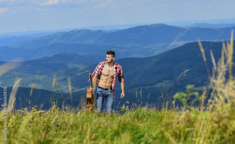 Carefree wanderer. Vast expanses. Peaceful hiker. Conquer the peaks. Man hiker with guitar walking on top of mountain. Guy hiker enjoy pure nature. Musician hiker find inspiration in mountains Carefree wanderer. Vast expanses. Peaceful hiker. Conquer the peaks. Man hiker with guitar walking on top of mountain. Guy hiker enjoy pure nature. Musician hiker find inspiration in mountains