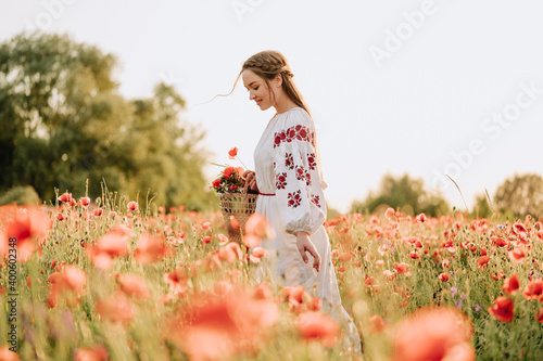 Fotografija Girl in Traditional Clothing Walking on Field