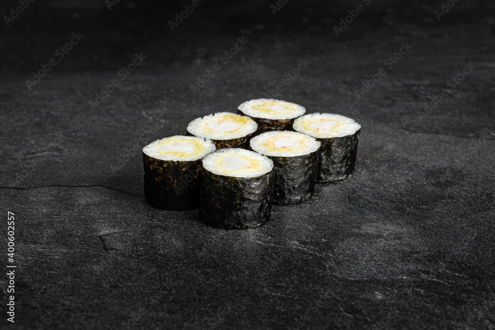 Sushi Rolls. Sushi Rolls Set, maki, philadelphia and california rolls, on a Black background. Sushi Rolls. Sushi Rolls Set, maki, philadelphia and california rolls, on a Black background.
