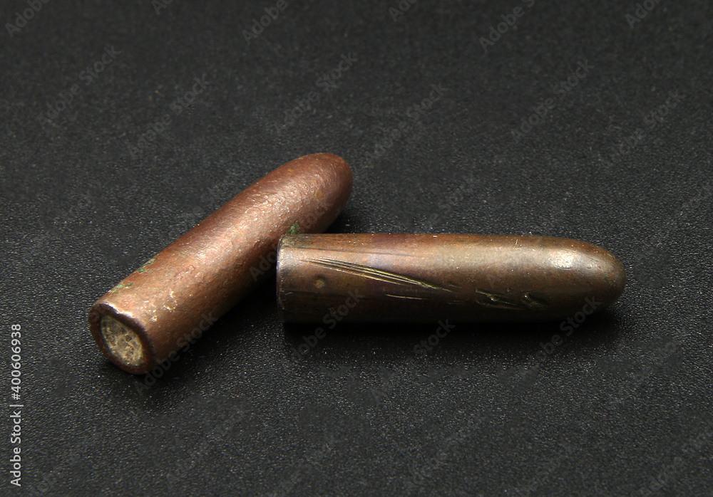 vintage rifle bullets on black background