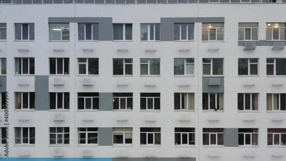 Hospital building exterior on a cloudy day. Aerial side view of a clinic windows Hospital building exterior on a cloudy day. Aerial side view of a clinic windows