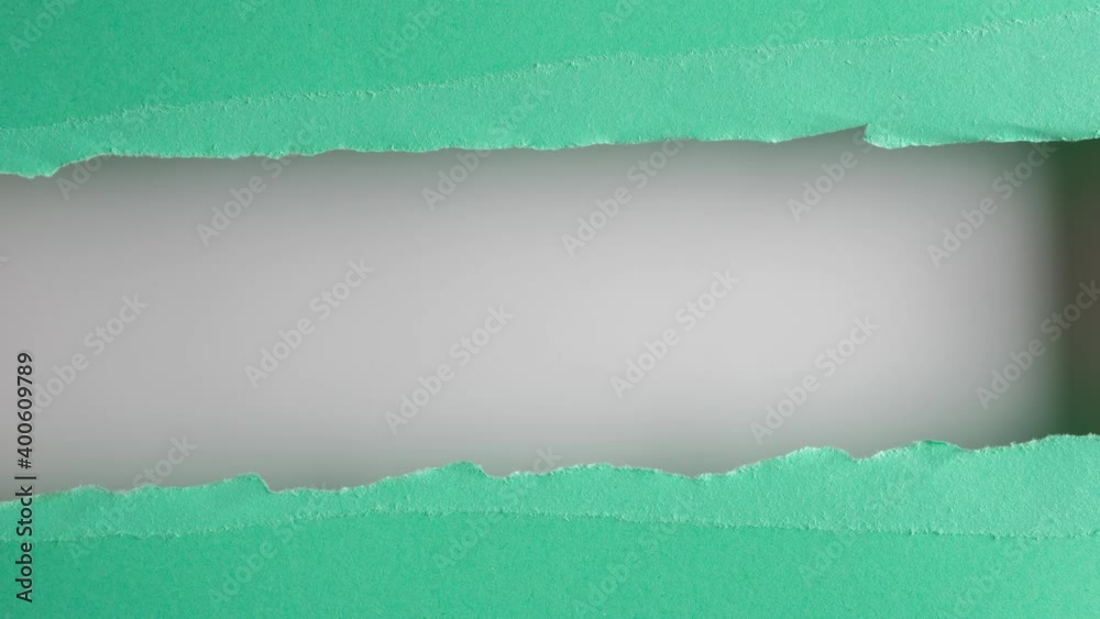 Turquoise paper is torn over white background for message, stop motion, animation. Template for your text.