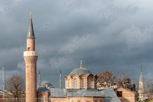 View of the Vefa Church Mosque with the minarets and dome of the Fatih mosque photo