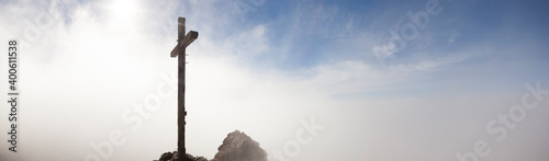 Summit cross of Taubenstein mountain in Bavaria, Germany photo