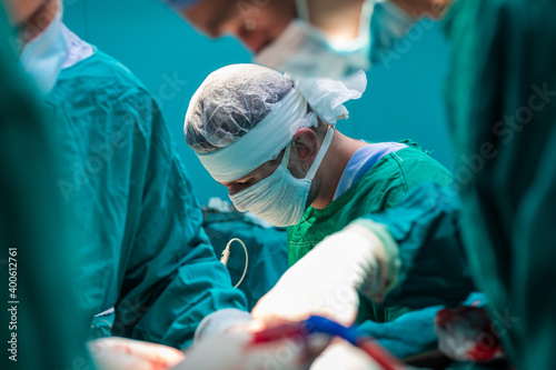 Fototapeta Naklejka Na Ścianę i Meble -  Team of surgeons performing surgery in hospital