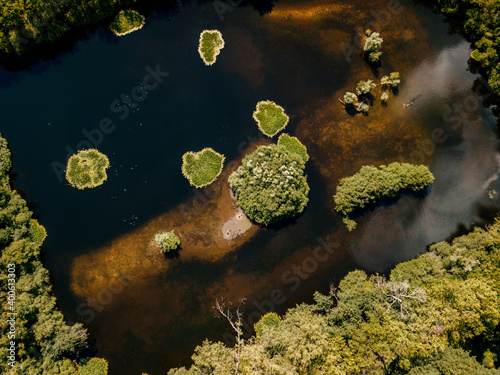 Photos Aerial drone shot of the top-down view of the small islands on the lake
