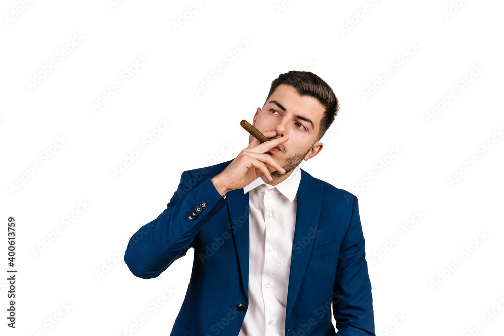 portrait on a white background of a young businessman in a suit and shirt smoking a cigar portrait on a white background of a young businessman in a suit and shirt smoking a cigar