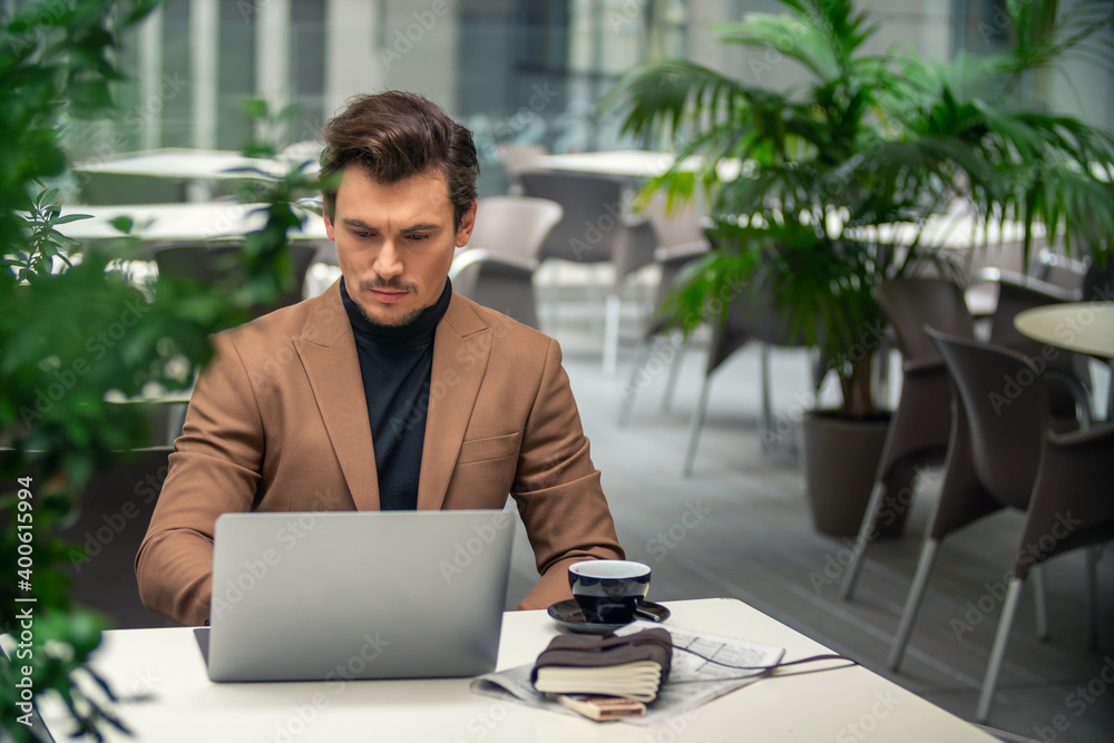 businessman sitting at a computer businessman sitting at a computer