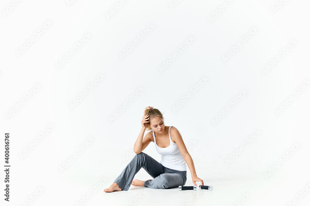 woman in sportswear with dumbbells on the floor muscle bodybuilding fitness woman in sportswear with dumbbells on the floor muscle bodybuilding fitness