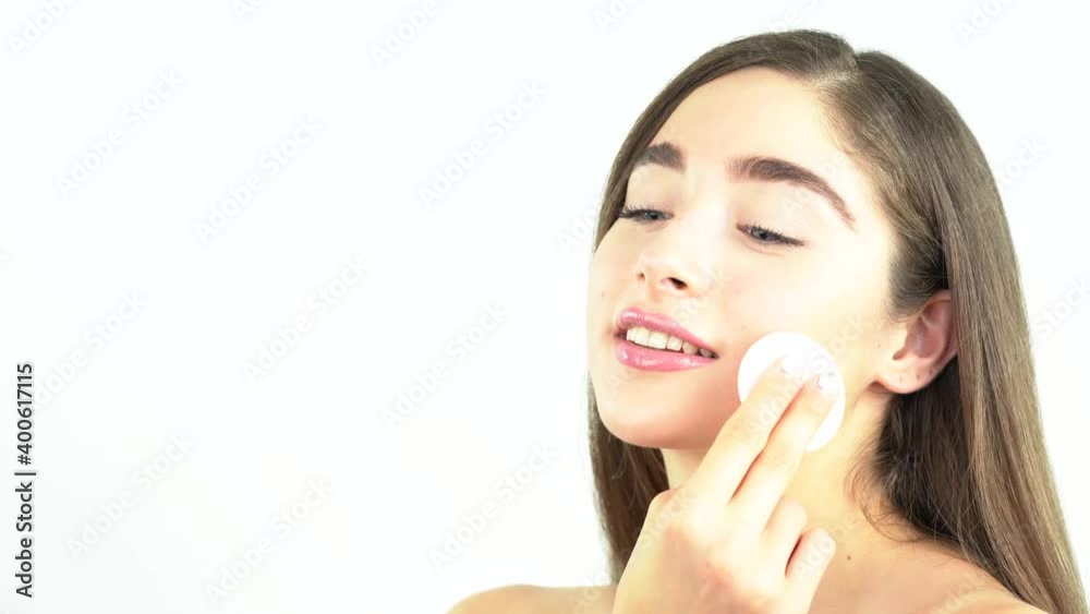 Cotton pad model woman face, cosmetology remover makeup, clear. Beautiful blonde woman removing makeup from her face skin Cotton pad model woman face, cosmetology remover makeup, clear. Beautiful blonde woman removing makeup from her face skin