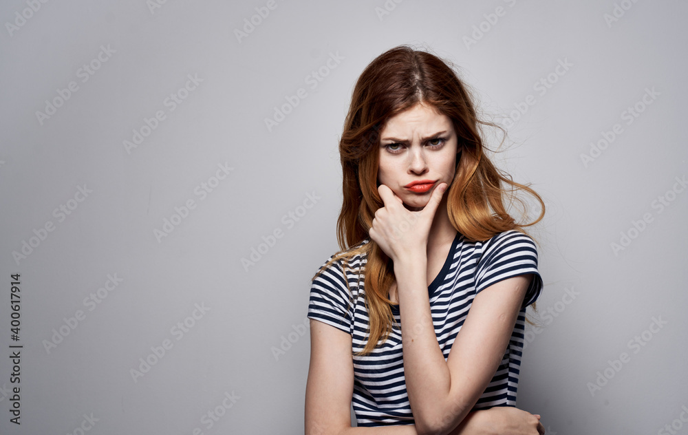 Cheerful pretty woman striped t-shirt glamor smile cosmetics emotions isolated background Cheerful pretty woman striped t-shirt glamor smile cosmetics emotions isolated background