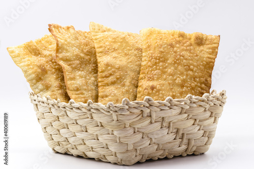 Brazilian pastry, traditional pasta called meat pastry on isolated on white background, copyspace photo