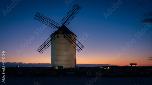 Exterior view of windmills on landscape in spring in Campo de Criptana at sunrise, Ciudad Real, Spain