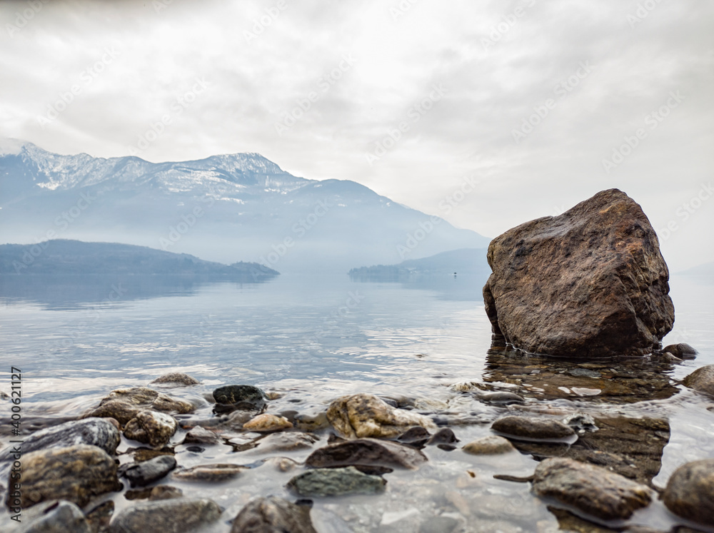 Rock on the lakeside of Lake Como in winter