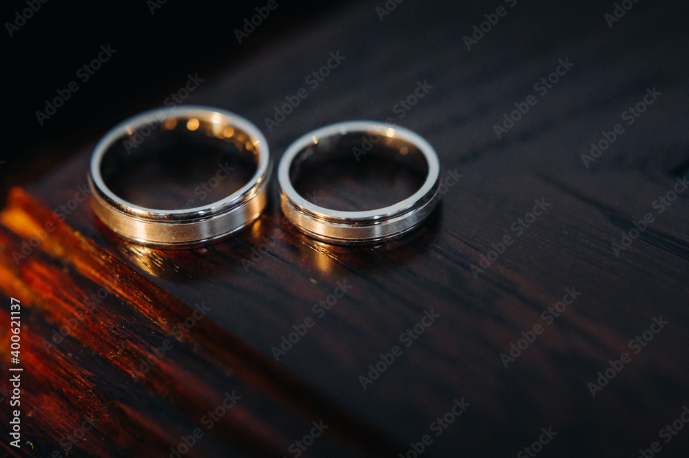 close-up of two gold wedding rings close-up of two gold wedding rings