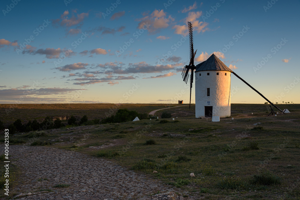 Exterior view of famous windmills on landscape in the town of Campo de Criptana at sunrise, Ciudad Real, Spain