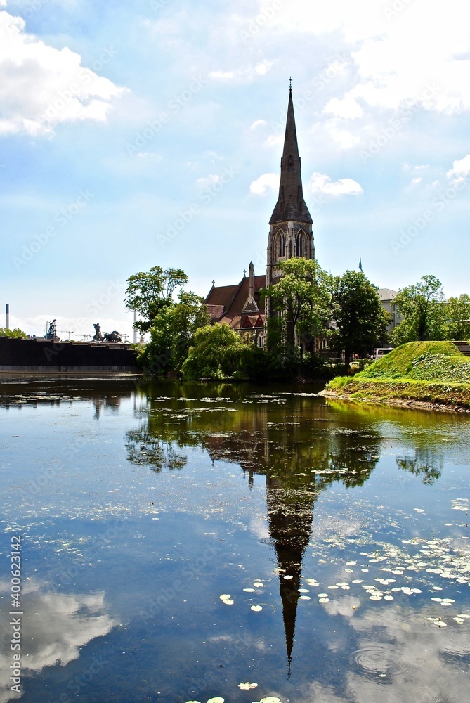 Copenhagen, Denmark: St. Alban's Church, locally often referred to simply as the English Church, is an Anglican church in Copenhagen, Denmark. The steeple reflects on the water. 