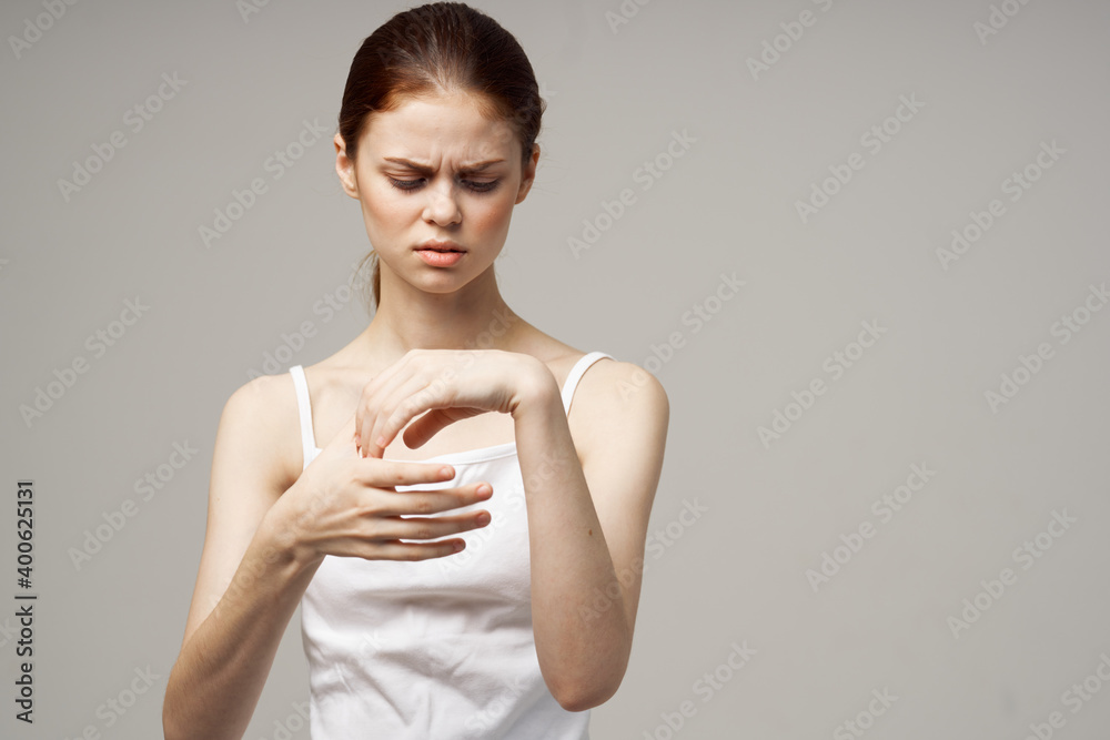 pretty woman in white t-shirt gesturing with hands on light background cropped view pretty woman in white t-shirt gesturing with hands on light background cropped view