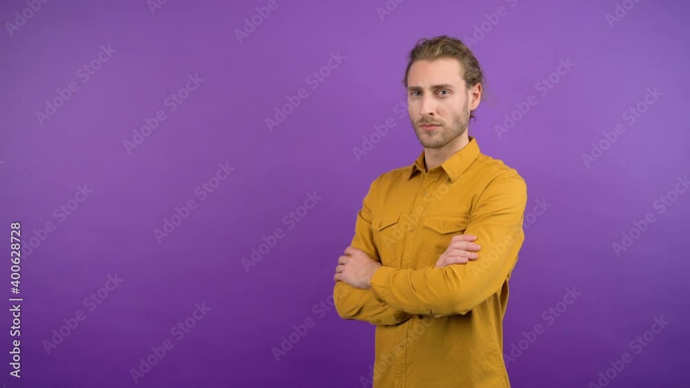 three-quarter portrait of a long-haired man with folded arms. 4K three-quarter portrait of a long-haired man with folded arms. 4K