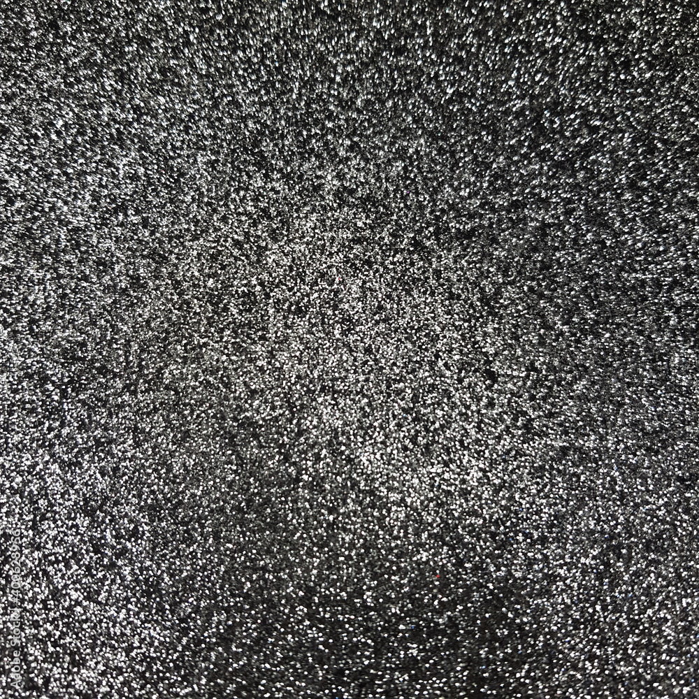 Black Glitter background. Brilliant dust abstract surface. Shimmer hologram crystal texture. Holiday sparkle backdrop. Black Glitter background. Brilliant dust abstract surface. Shimmer hologram crystal texture. Holiday sparkle backdrop.