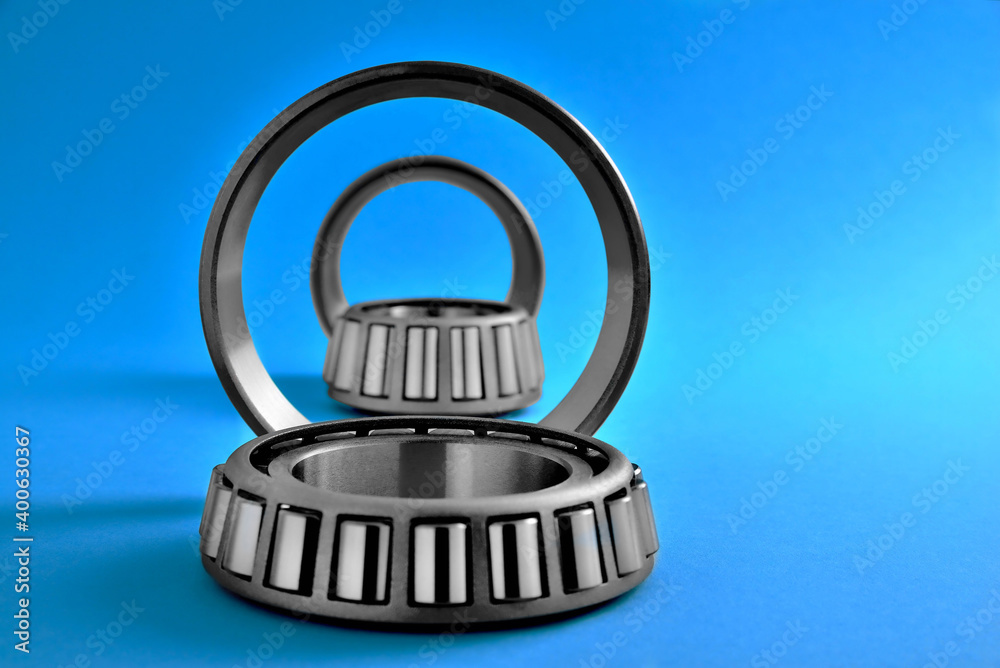 roller bearings on a blue background, your idea, blur as the author's idea, copy space roller bearings on a blue background, your idea, blur as the author's idea, copy space