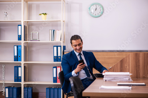 Young male employee working in the office