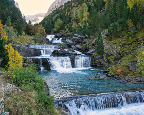 waterfall in river with turquoise water