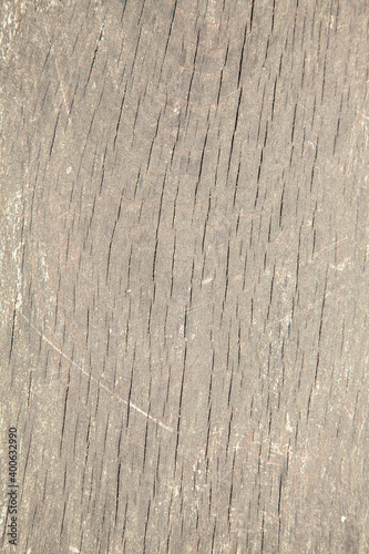 Grungy cracked wooden board by close up textured background. Free space for designer.