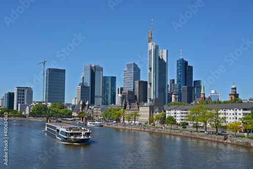 A boat on the river Main in the background the skyline of Frankfurt on Main  in Germany